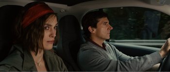 Movie still from “Seeking a Friend for the End of the World” (2012), directed by Lorene Scafaria – A man and a woman sitting in the back seat of a car; Close Up shot, Over the shoulder angle