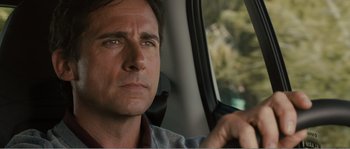 Movie still from “Seeking a Friend for the End of the World” (2012), directed by Lorene Scafaria – A person sitting in a car looking out the window; Close Up shot, Over the shoulder angle