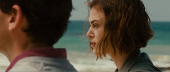 Movie still from “Seeking a Friend for the End of the World” (2012), directed by Lorene Scafaria – A person near a body of water; Close Up shot, Over the shoulder angle