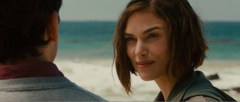 Movie still from “Seeking a Friend for the End of the World” (2012), directed by Lorene Scafaria – A woman's face on the beach; Close Up shot, Over the shoulder angle