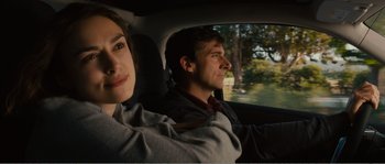 Movie still from “Seeking a Friend for the End of the World” (2012), directed by Lorene Scafaria – A man and a woman sitting in the back of a car; Close Up shot, Over the shoulder angle