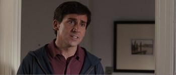 Movie still from “Seeking a Friend for the End of the World” (2012), directed by Lorene Scafaria – A person wearing a red shirt; Close Up shot, Over the shoulder angle