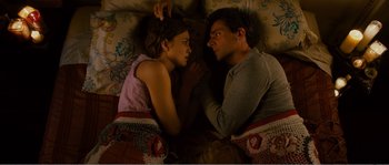 Movie still from “Seeking a Friend for the End of the World” (2012), directed by Lorene Scafaria – A man and a woman laying in bed together; Medium shot, Overhead angle