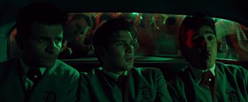 Movie still from “Selena” (1997), directed by Gregory Nava – A man sitting in the back of a car at night; Medium shot, Low angle
