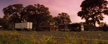 Movie still from “Selena” (1997), directed by Gregory Nava – A view of a motel from across the street; Extreme Wide shot, Low angle