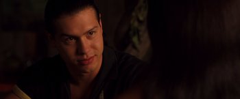 Movie still from “Selena” (1997), directed by Gregory Nava – A man's face in the dark; Close Up shot, Over the shoulder angle