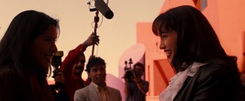 Movie still from “Selena” (1997), directed by Gregory Nava – A group of people standing next to each other; Medium shot, Over the shoulder angle