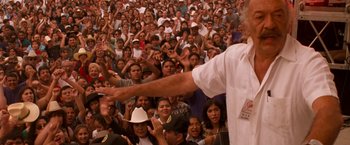 Movie still from “Selena” (1997), directed by Gregory Nava – A large crowd of people are gathered together; Medium shot, High angle