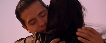 Movie still from “Selena” (1997), directed by Gregory Nava – A man and a woman are kissing each other; Close Up shot, Low angle