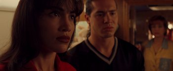 Movie still from “Selena” (1997), directed by Gregory Nava – A man and a woman standing next to each other; Close Up shot, Over the shoulder angle