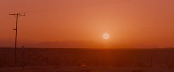 Movie still from “Selena” (1997), directed by Gregory Nava – The sun is setting in the middle of the desert; Extreme Wide shot, Low angle