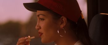 Movie still from “Selena” (1997), directed by Gregory Nava – A person wearing a hat; Close Up shot, Over the shoulder angle