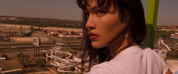 Movie still from “Selena” (1997), directed by Gregory Nava – A person near a water slide; Close Up shot, Low angle