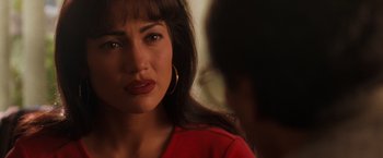 Movie still from “Selena” (1997), directed by Gregory Nava – A person wearing a red shirt; Close Up shot, Over the shoulder angle