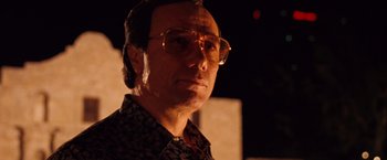 Movie still from “Selena” (1997), directed by Gregory Nava – A person wearing glasses; Close Up shot, Low angle