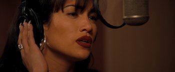 Movie still from “Selena” (1997), directed by Gregory Nava – A woman's face with red lipstick; Close Up shot, High angle