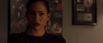 Movie still from “Selena” (1997), directed by Gregory Nava – A person wearing a black shirt; Close Up shot, Over the shoulder angle