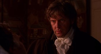 Movie still from “Sense and Sensibility” (1995), directed by Ang Lee – A person wearing a neck scarf; Close Up shot, Over the shoulder angle