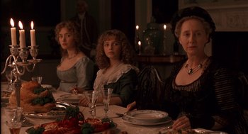 Movie still from “Sense and Sensibility” (1995), directed by Ang Lee – A group of people sitting at a dinner table; Medium shot, High angle