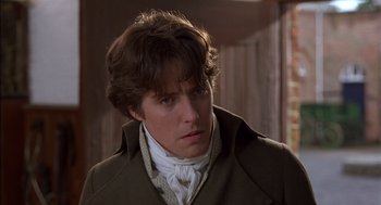Movie still from “Sense and Sensibility” (1995), directed by Ang Lee – A person wearing a coat; Close Up shot, Over the shoulder angle