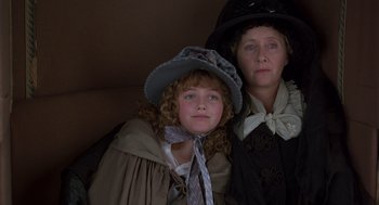 Movie still from “Sense and Sensibility” (1995), directed by Ang Lee – A woman and a child dressed in period clothing; Close Up shot, High angle