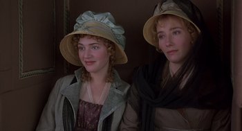 Movie still from “Sense and Sensibility” (1995), directed by Ang Lee – Two young women wearing hats and scarves posing for a picture; Close Up shot, High angle