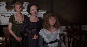 Movie still from “Sense and Sensibility” (1995), directed by Ang Lee – Two women and a girl dressed in period clothing; Medium shot, High angle
