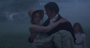 Movie still from “Sense and Sensibility” (1995), directed by Ang Lee – A man and a woman are hugging in the fog; Medium shot, High angle