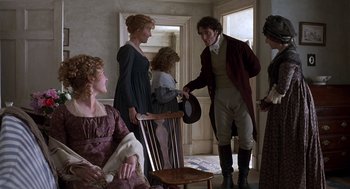 Movie still from “Sense and Sensibility” (1995), directed by Ang Lee – A group of people standing in a room; Medium shot, Over the shoulder angle