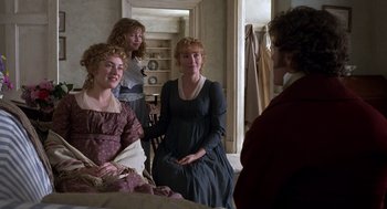 Movie still from “Sense and Sensibility” (1995), directed by Ang Lee – A group of people in a room talking to each other; Medium shot, Over the shoulder angle