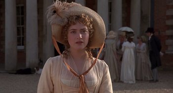 Movie still from “Sense and Sensibility” (1995), directed by Ang Lee – A woman in a straw hat and a dress; Close Up shot, Over the shoulder angle