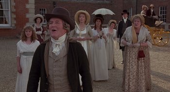 Movie still from “Sense and Sensibility” (1995), directed by Ang Lee – A group of people dressed in period clothing; Medium shot, Low angle