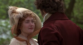 Movie still from “Sense and Sensibility” (1995), directed by Ang Lee – A man and a woman in a hat and dress; Close Up shot, Over the shoulder angle