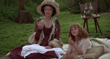 Movie still from “Sense and Sensibility” (1995), directed by Ang Lee – A woman and a girl sitting on the grass; Medium shot, High angle