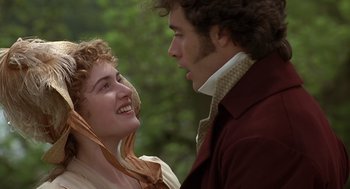 Movie still from “Sense and Sensibility” (1995), directed by Ang Lee – A man and a woman standing next to each other; Close Up shot, Over the shoulder angle