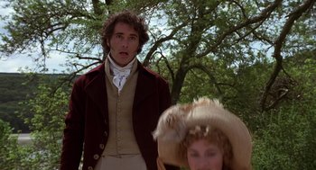 Movie still from “Sense and Sensibility” (1995), directed by Ang Lee – A man and a woman standing next to each other in front of a tree; Medium shot, Over the shoulder angle