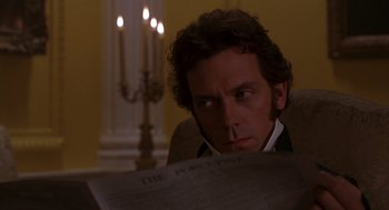 Movie still from “Sense and Sensibility” (1995), directed by Ang Lee – A man sitting in front of a lit candle; Close Up shot, Over the shoulder angle