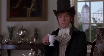 Movie still from “Sense and Sensibility” (1995), directed by Ang Lee – A man holding a white cup in his hand; Medium shot, Over the shoulder angle