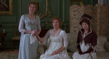 Movie still from “Sense and Sensibility” (1995), directed by Ang Lee – A group of women sitting on a couch in front of a wall; Medium shot, High angle