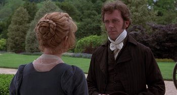 Movie still from “Sense and Sensibility” (1995), directed by Ang Lee – A man and a woman standing next to each other outside; Medium shot, Over the shoulder angle