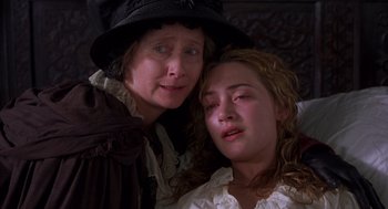 Movie still from “Sense and Sensibility” (1995), directed by Ang Lee – Two women are sitting next to each other; Close Up shot, High angle