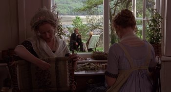 Movie still from “Sense and Sensibility” (1995), directed by Ang Lee – Two women in period dress looking at a man in a suit; Wide shot, Over the shoulder angle