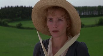 Movie still from “Sense and Sensibility” (1995), directed by Ang Lee – A person wearing a straw hat; Close Up shot, Over the shoulder angle