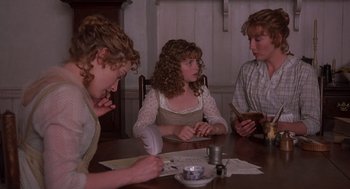 Movie still from “Sense and Sensibility” (1995), directed by Ang Lee – A group of people sitting at a table with papers; Medium shot, High angle