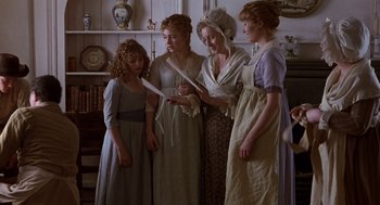 Movie still from “Sense and Sensibility” (1995), directed by Ang Lee – A group of people in period dress standing next to each other in a room; Medium shot, High angle