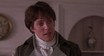 Movie still from “Sense and Sensibility” (1995), directed by Ang Lee – A young man wearing an old - fashioned jacket and neck tie; Close Up shot, Over the shoulder angle
