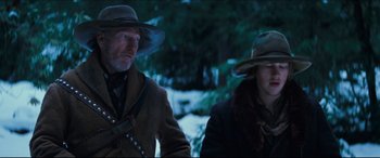 Movie still from “Seraphim Falls” (2006), directed by David Von Ancken – Two men in hats and jackets standing next to each other in the snow; Medium shot, Low angle