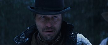 Movie still from “Seraphim Falls” (2006), directed by David Von Ancken – A person wearing a hat; Close Up shot, Low angle