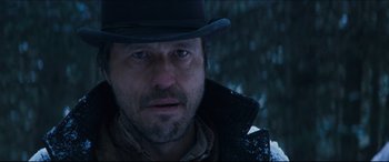 Movie still from “Seraphim Falls” (2006), directed by David Von Ancken – A person wearing a hat; Close Up shot, Low angle