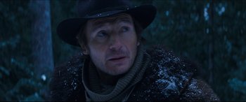 Movie still from “Seraphim Falls” (2006), directed by David Von Ancken – A person wearing a hat and a scarf; Close Up shot, Low angle